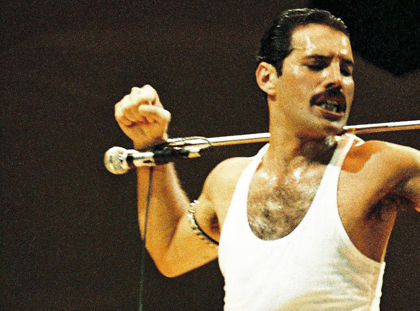 LONDON, UNITED KINGDOM - JULY 13: Freddie Mercury of Queen performs on stage at Live Aid on July 13th, 1985 in Wembley Stadium, London, England (Photo by Peter Still/Redferns)